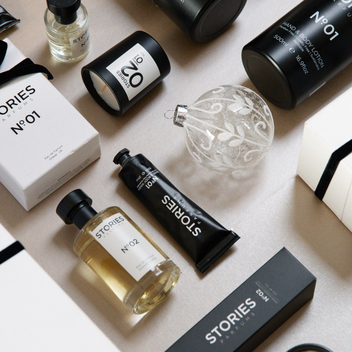 STORIES Nº.01 Christmas flat lay with Eau de Parfum, Hand & Body and travel sizes