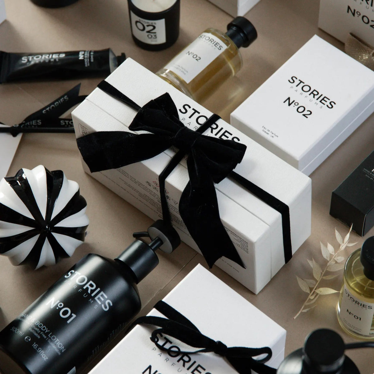 STORIES Christmas Gift Box, white with black ribbon, with STORIES Nº.02 Eau de Parfum and candle