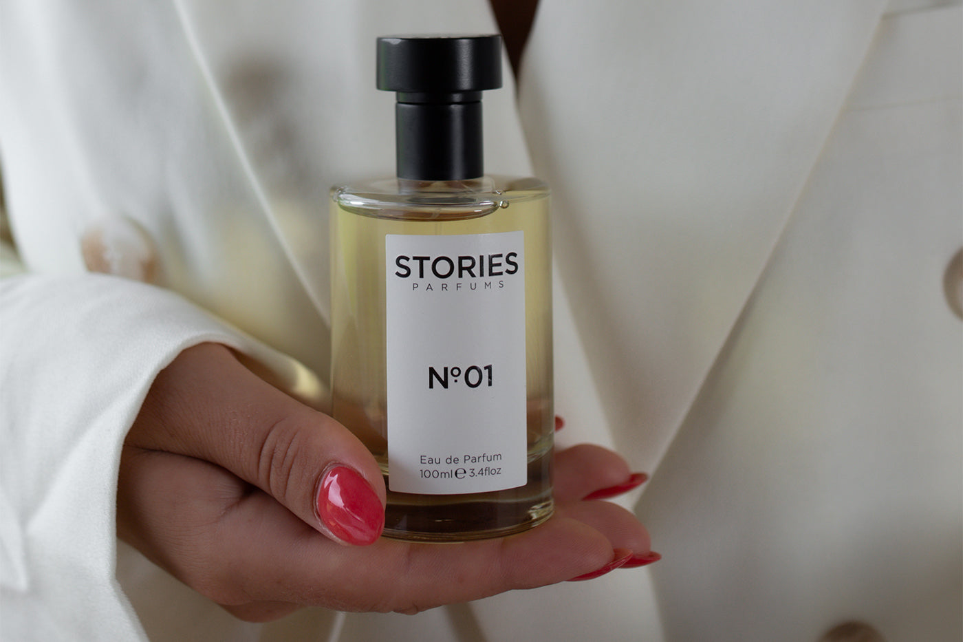 Woman holding STORIES Parfums wedding fragrance scent