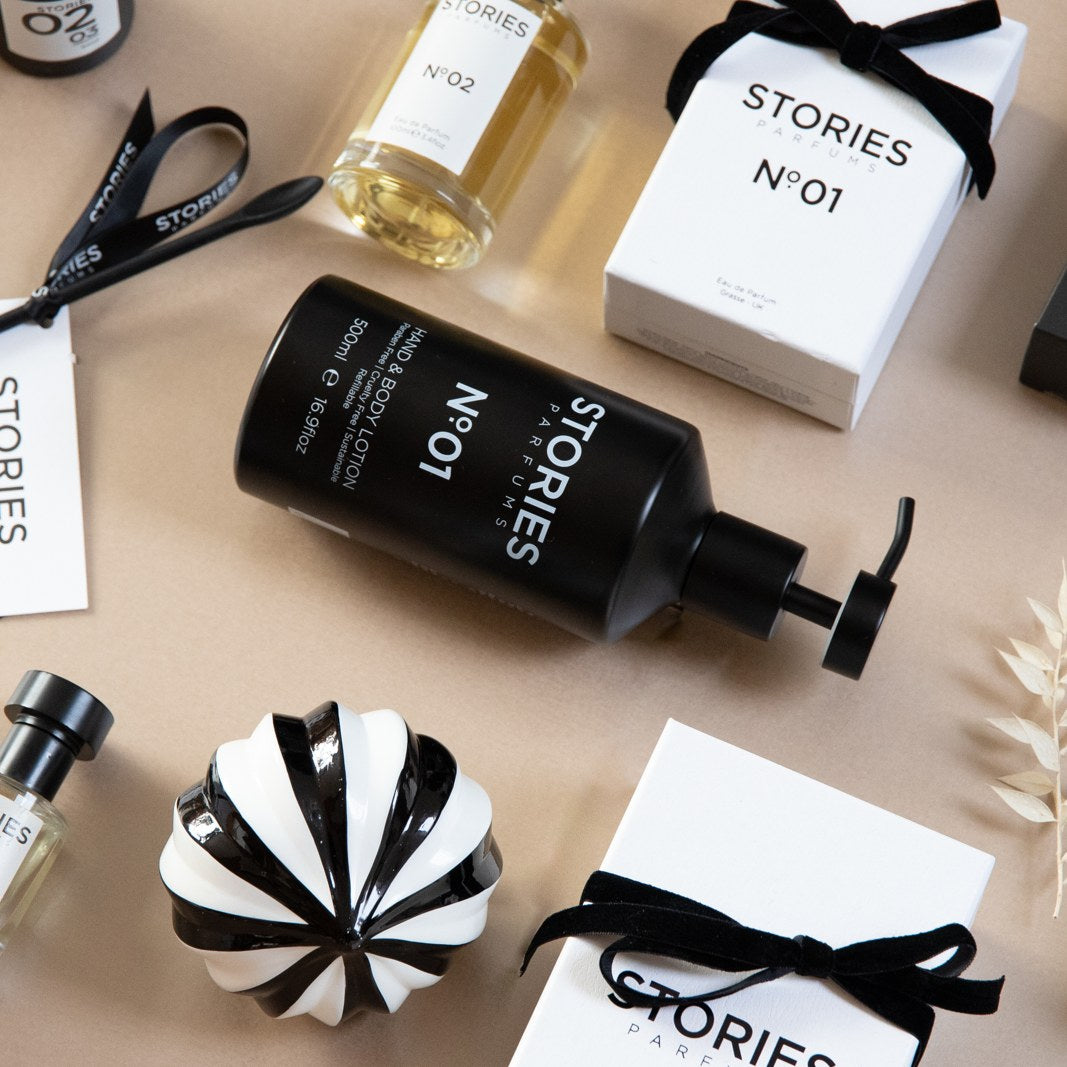 STORIES Nº.01 and STORIES Nº.02 Eau de Parfum 30ml in a Christmas flat lay with black velvet ribbon